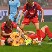 Portarul lui Heindenheim, Kevin Muller, inconștient după ciocnirea cu Ibrahima Sissoko în meciul cu Bochum / Foto: Imago