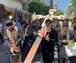Gigi Becali a ieșit pe Calea Victoriei să „curețe” cu agheasmă după marșul LGBT: a purtat o cruce uriașă, apoi s-a oprit și a cântat